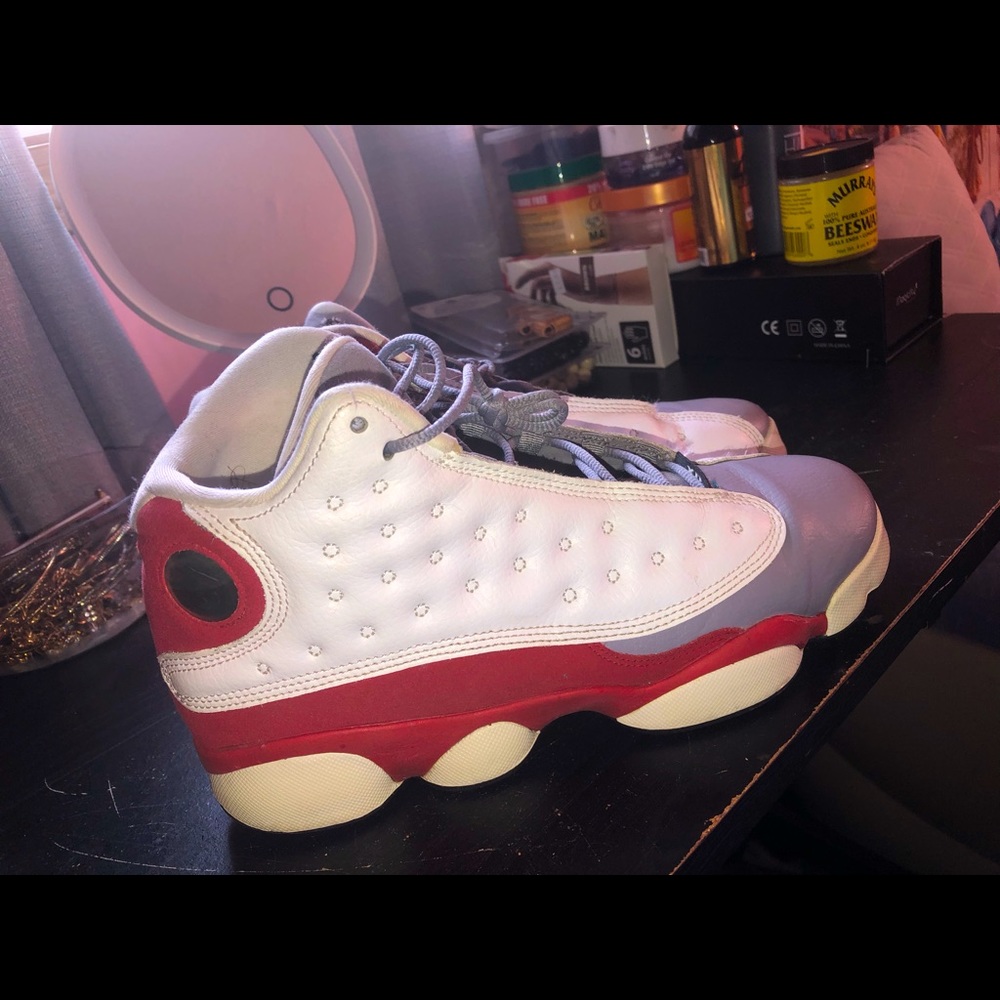 GRAY WHITE AND RED JORDAN 13. SIZE 7